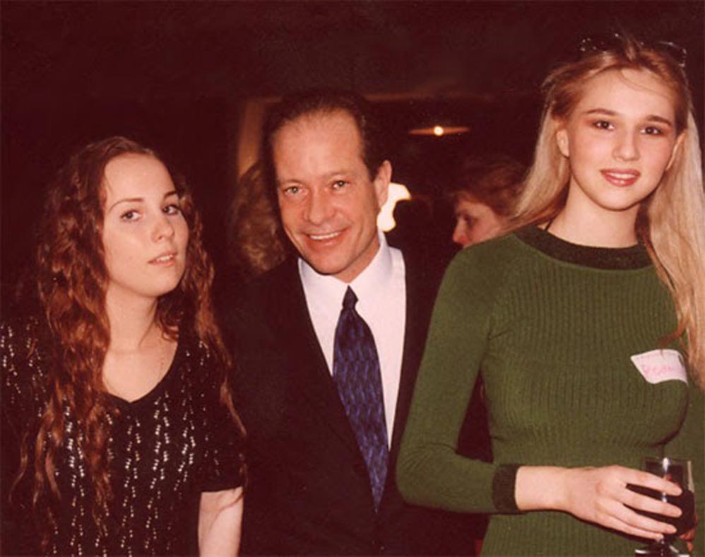 Man posing with two beautiful Russian ladies.